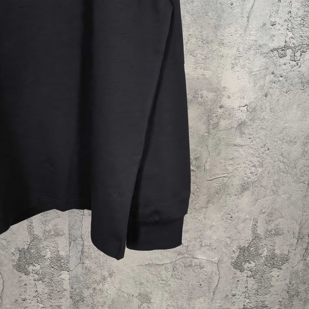 Black long-sleeve shirt with curved hem and plain sleeve