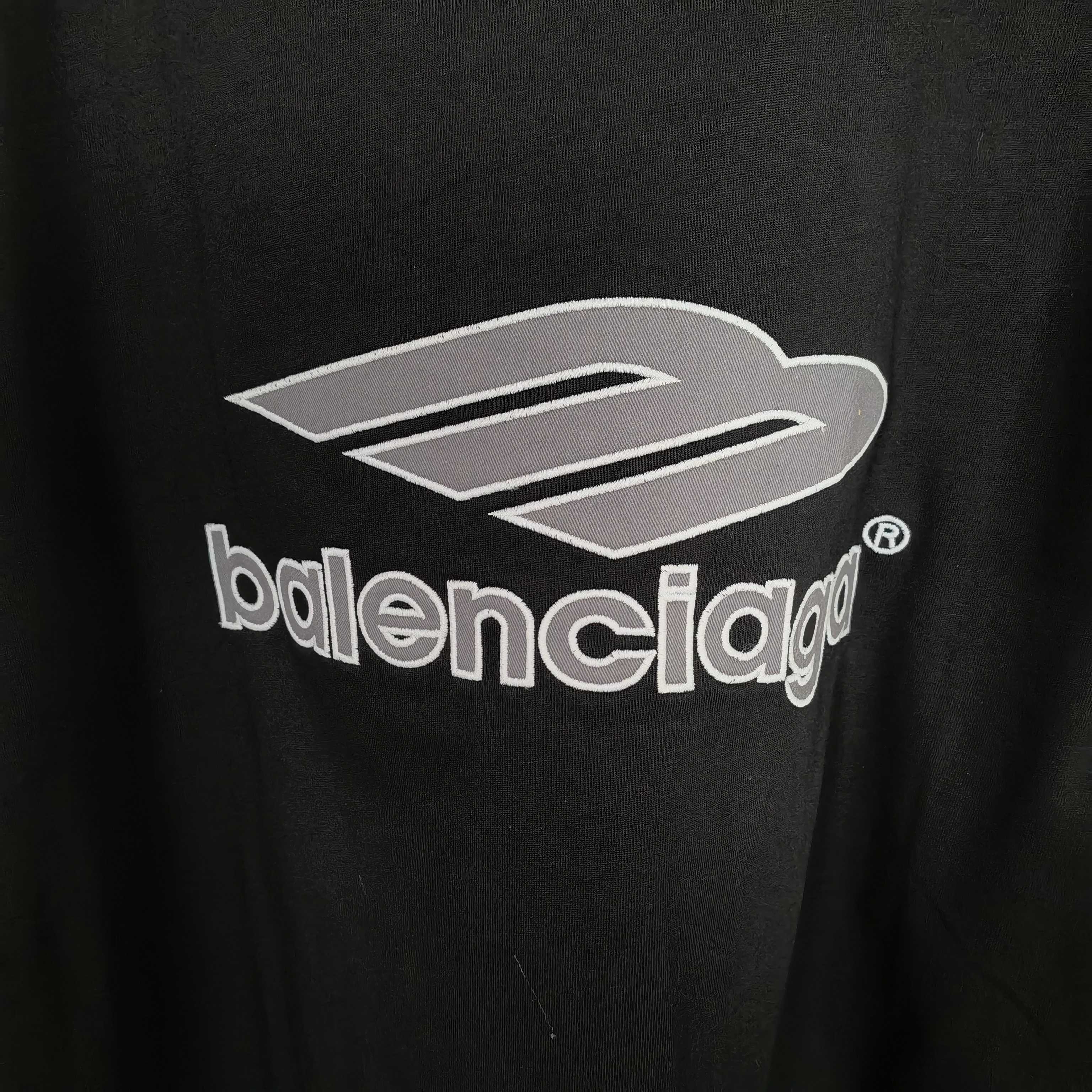 Black long-sleeve shirt with large Balenciaga logo graphic on chest