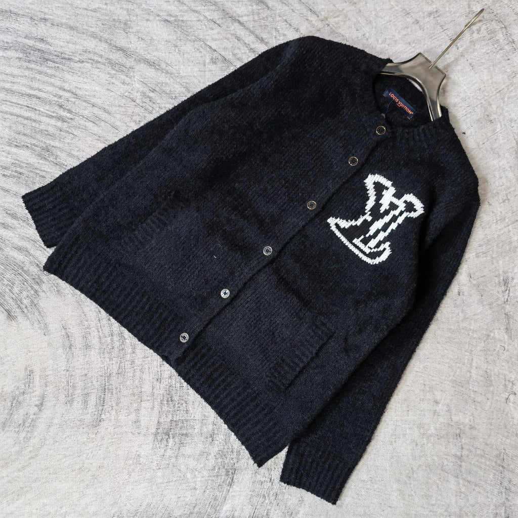 Louis Vuitton dark knit cardigan laid flat, button front and white LV logo