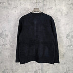 Louis Vuitton dark knit cardigan, back view with ribbed hem and cuffs