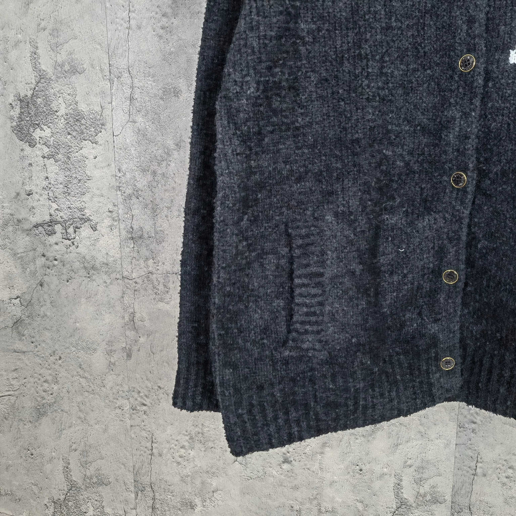 Louis Vuitton dark knit cardigan side view with button placket and ribbed hem