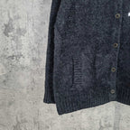 Louis Vuitton dark knit cardigan side view with button placket and ribbed hem