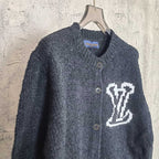 Louis Vuitton dark knit cardigan with white LV monogram on chest