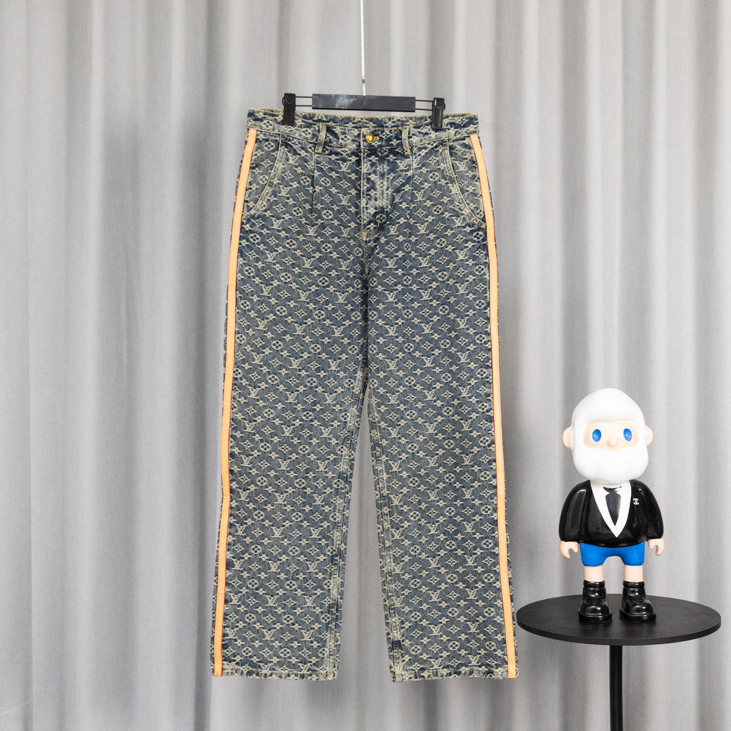 Louis Vuitton monogram denim pants with orange side stripe and front button closure