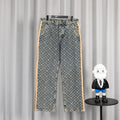 Louis Vuitton monogram denim pants with orange side stripe and front button closure