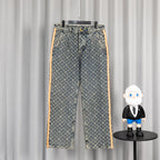 Louis Vuitton monogram denim pants with orange side stripe and front button closure