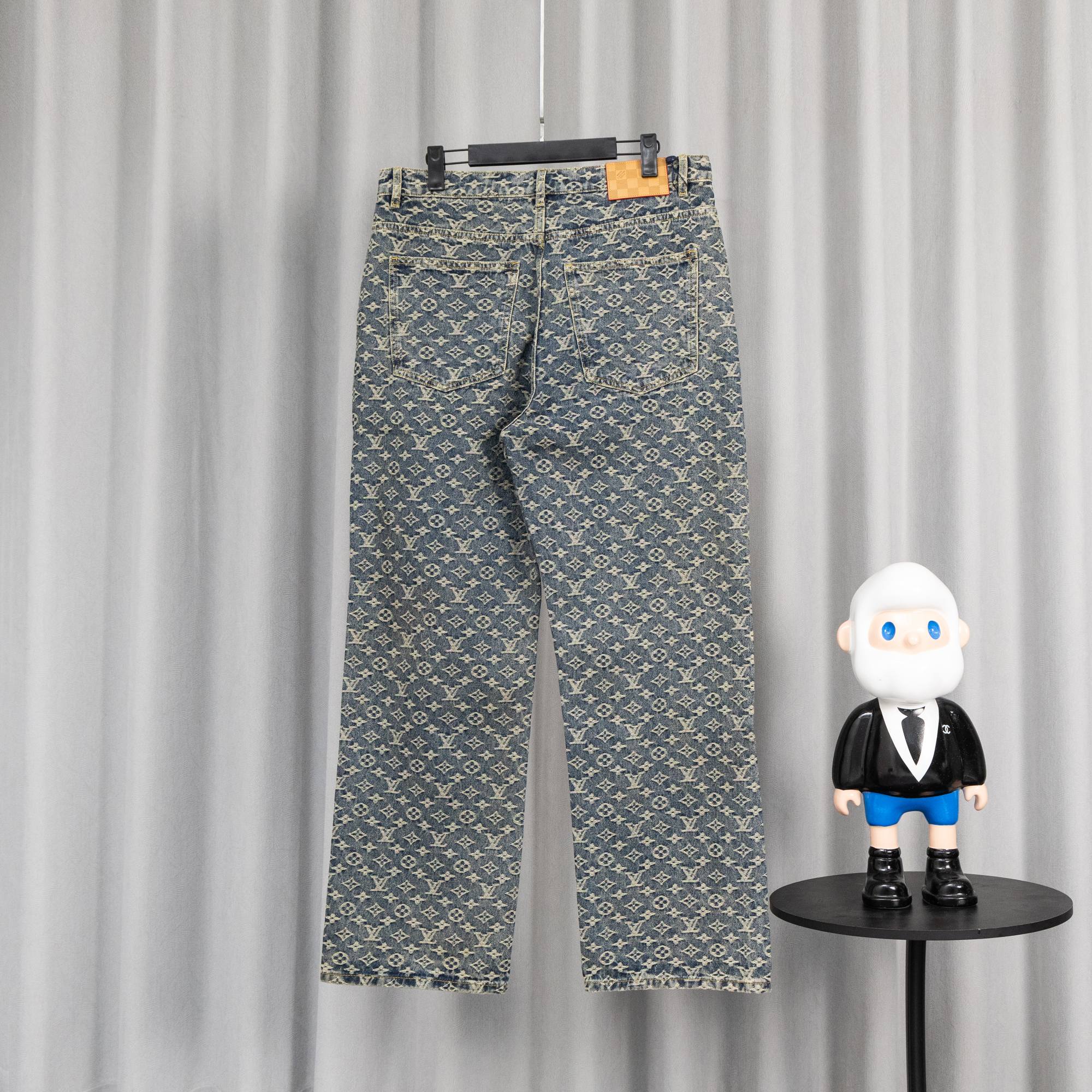 Louis Vuitton monogram denim pants with orange side stripe and belt loops