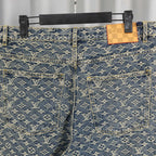 Louis Vuitton monogram denim pants with patch pockets and orange-trimmed seams