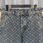 Louis Vuitton monogram denim pants, front view with dark button and fly detailing