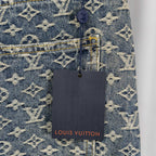 Louis Vuitton monogram denim pants with hanging brand tag near back pocket