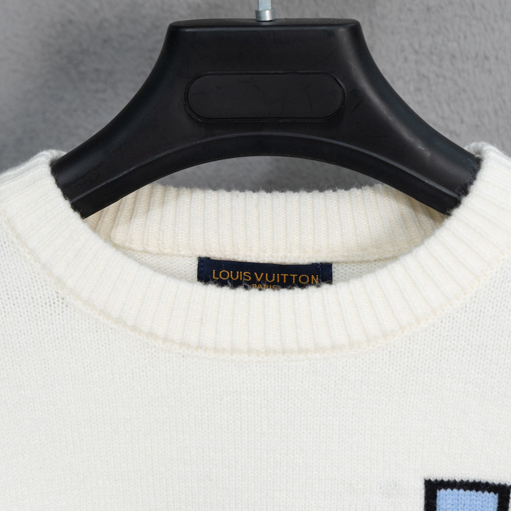 White ribbed crewneck sweater collar with Louis Vuitton logo label