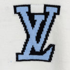 White knit sweater with oversized blue and black LV-style monogram on chest