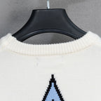 White ribbed crewneck sweater with black-and-blue logo graphic partially visible