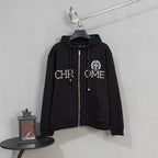 Black zip-up hoodie with pearl-studded front graphic and drawstring hood