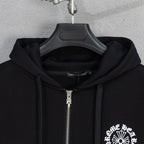 Black zip hoodie close-up with silver zipper and drawstring hood