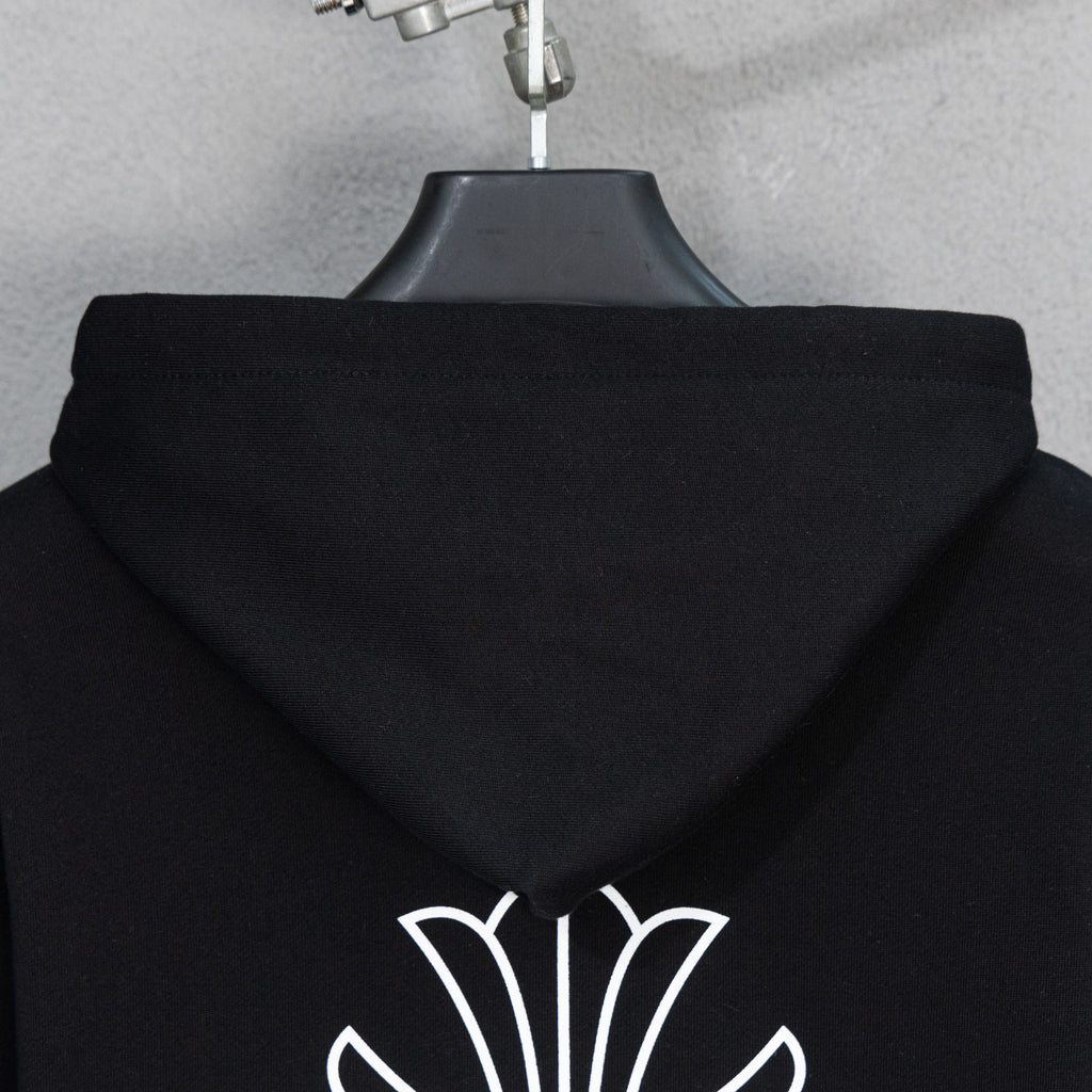 Black hoodie hood back with small pearl crest graphic at lower hem