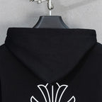 Black hoodie hood back with small pearl crest graphic at lower hem