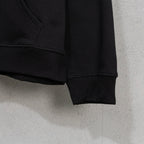 Black long-sleeve sweatshirt, ribbed cuff and hem detail
