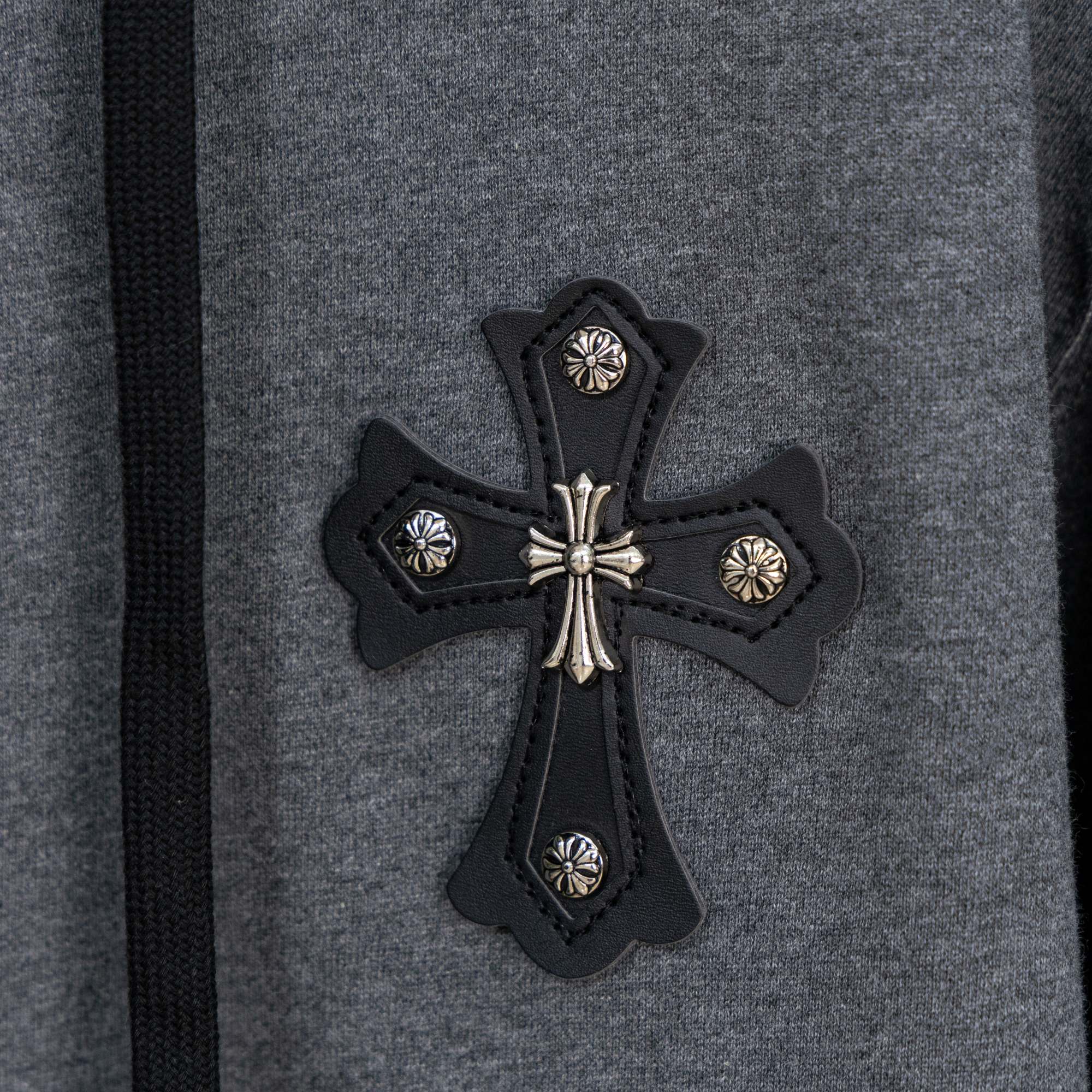 Grey hoodie chest cross appliqué with studded black trim