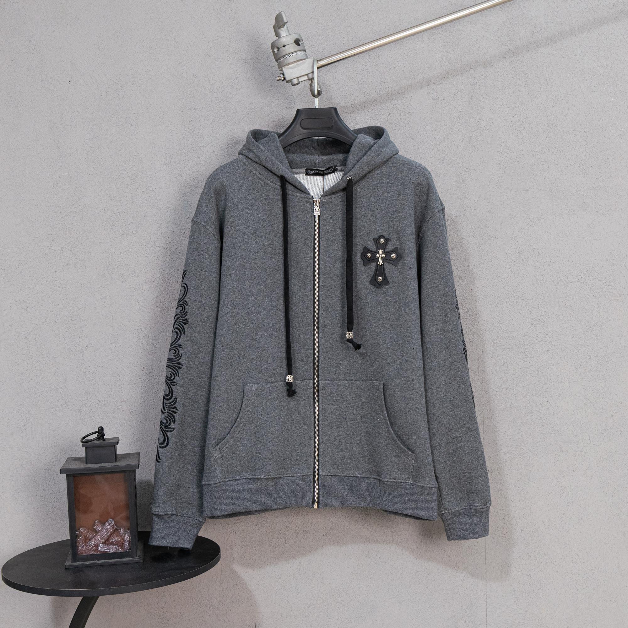 Grey zip-up hoodie with hood and black drawstrings