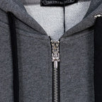 Grey zip-up hoodie close-up of silver zipper and inner hood lining