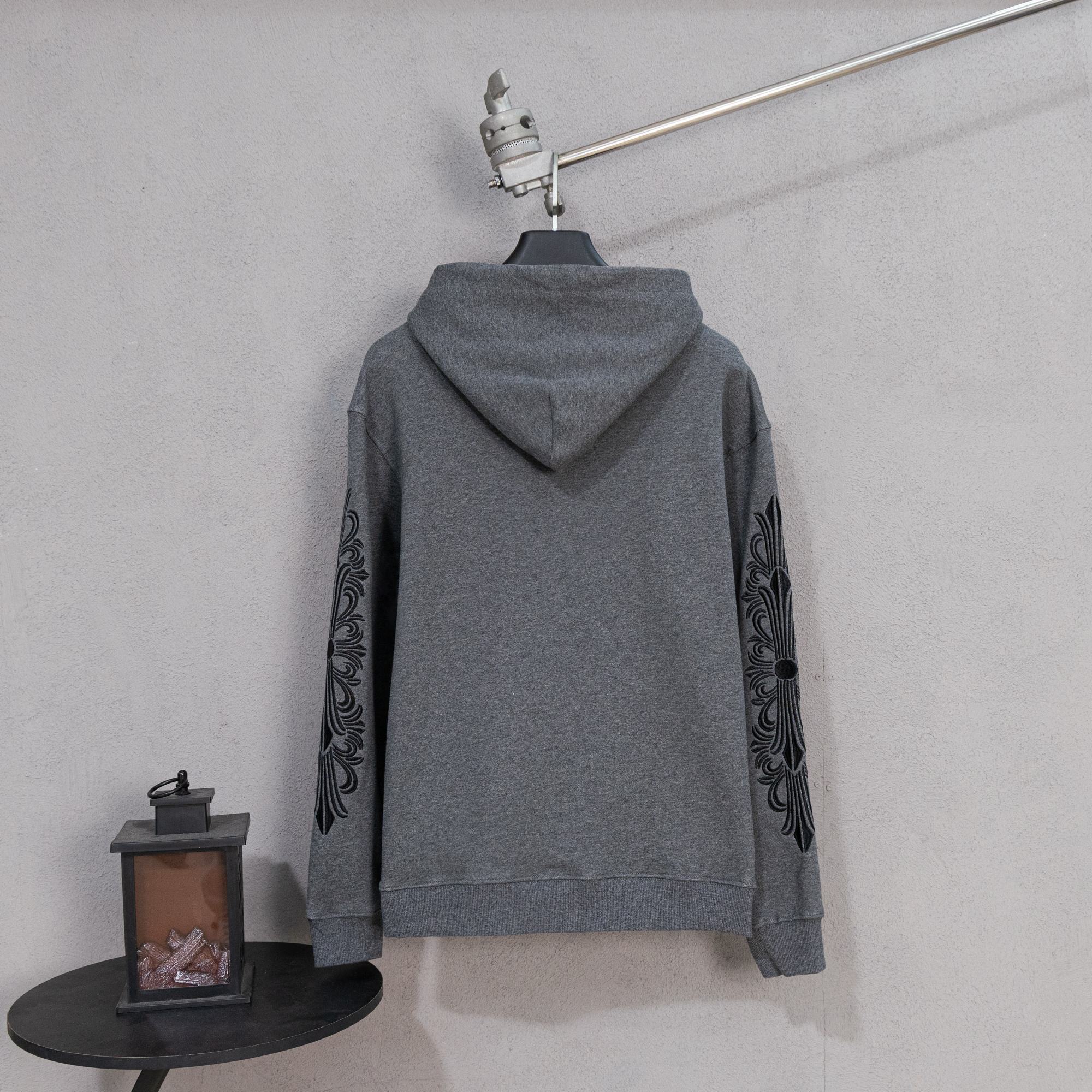 Grey zip-up hoodie back view with hood and sleeve scroll print