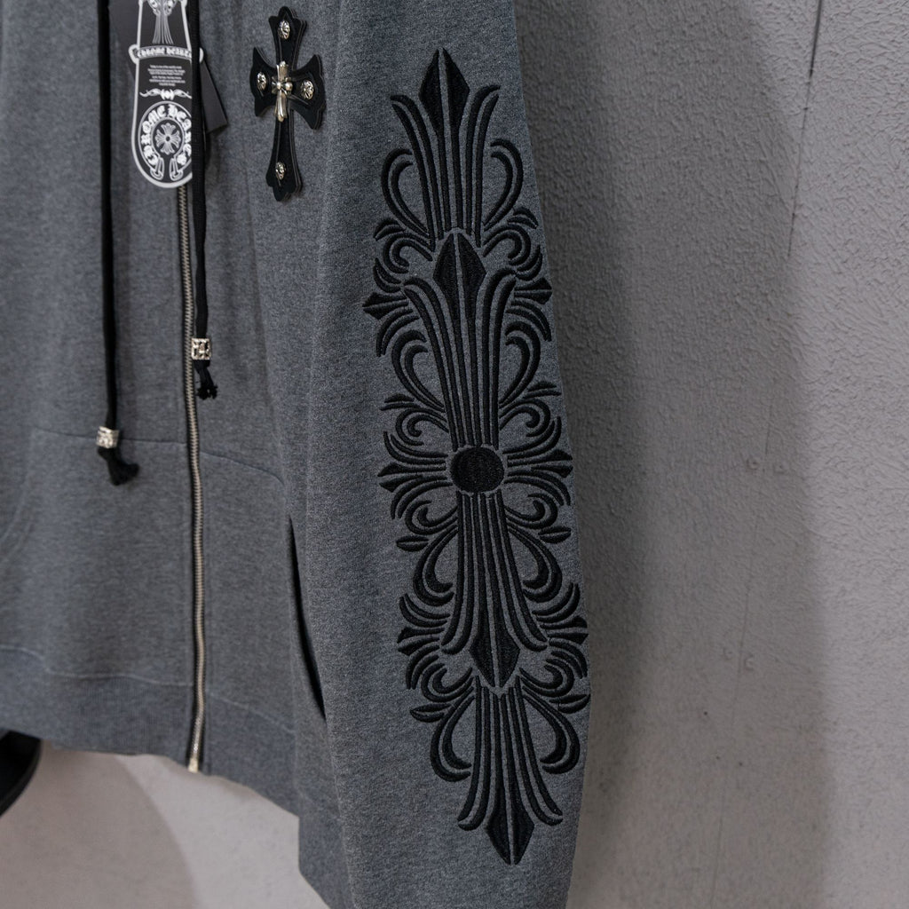 Grey hoodie sleeve panel with large black ornate floral design