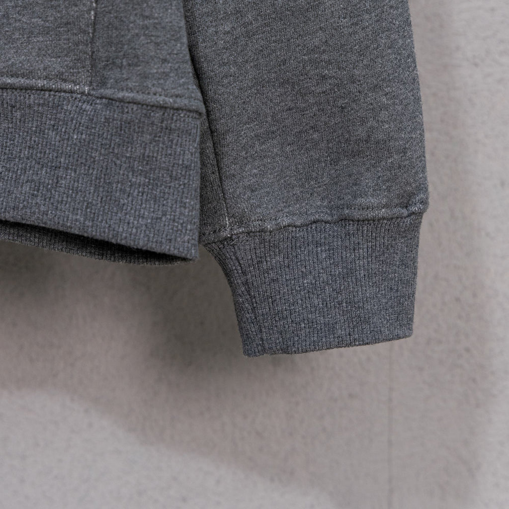 Grey zip-up hoodie hem and cuffs with ribbed knit trim