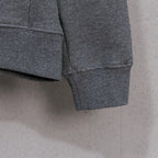 Grey zip-up hoodie hem and cuffs with ribbed knit trim