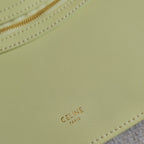CELINE PARIS logo stamp on light yellow-green leather with stitched edge