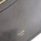 CELINE tote bag close-up of CELINE PARIS stamp on dark leather.