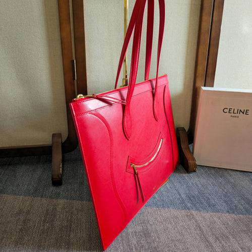 Celine tote bag, bright red leather, side view with top handles and front zipper