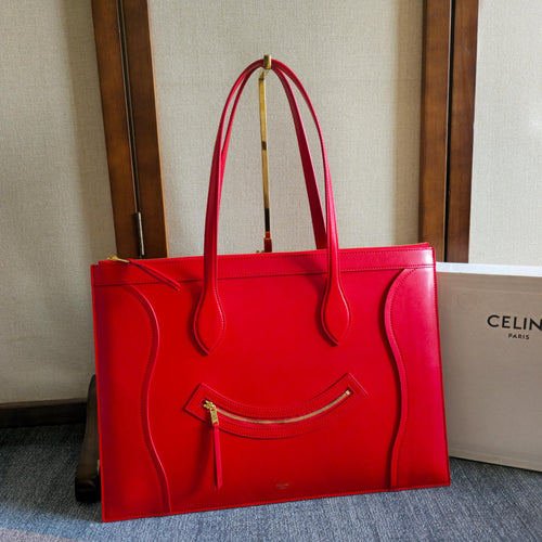Celine tote bag in bright red leather with two top handles and front zipper pocket