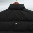 Black sleeveless puffer vest back with stand collar and snap button