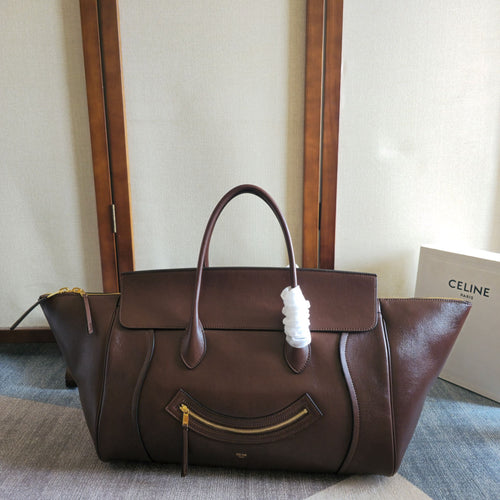 Brown leather tote bag with top handles and front zip pocket