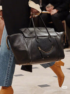Celine leather duffle bag, dark color, gold front zip pocket and top handles