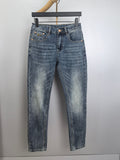 Blue denim pants with button closure, belt loops, and stitched front and back pockets
