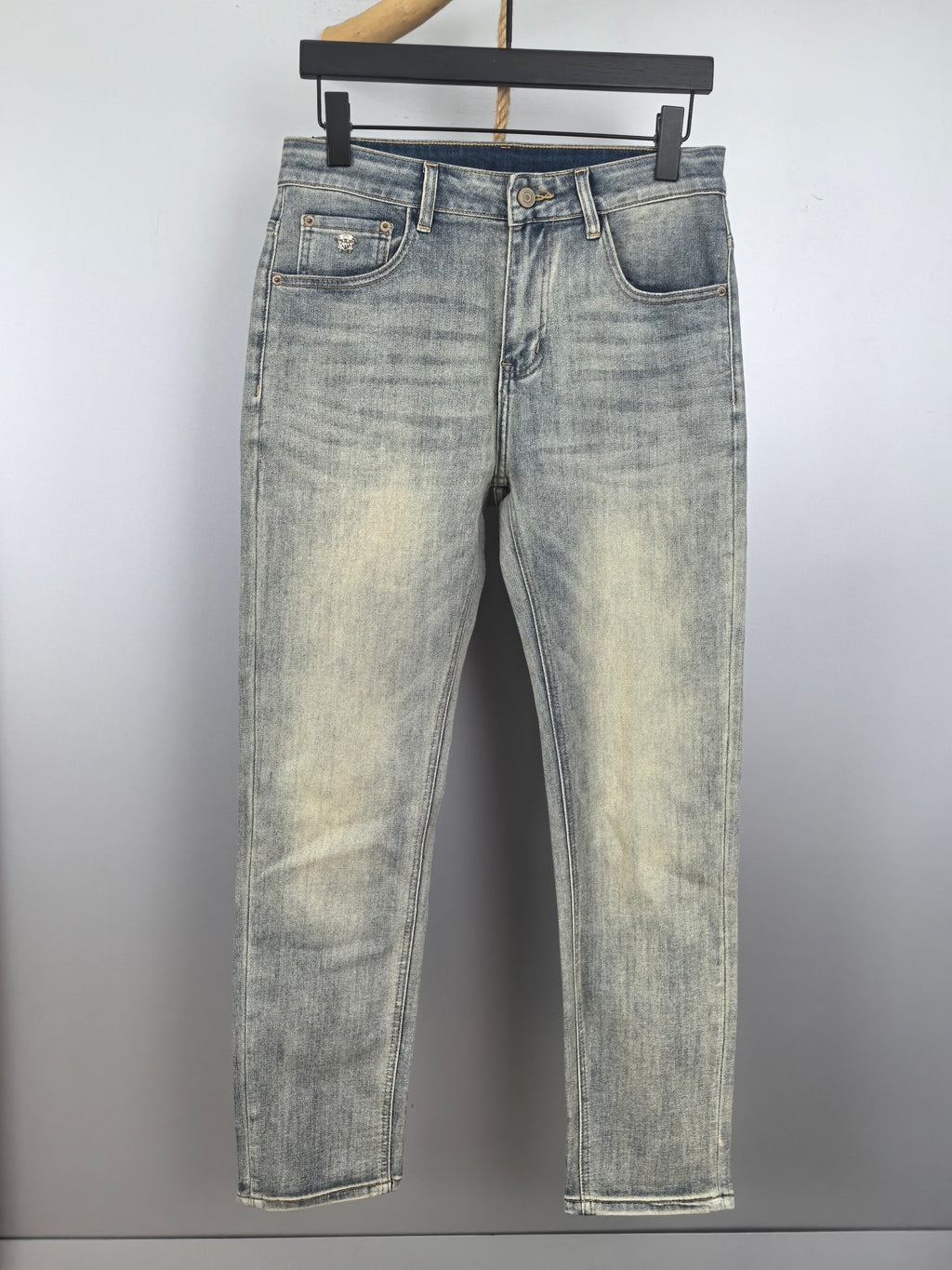 Washed light-blue denim jeans with belt loops and five-pocket styling