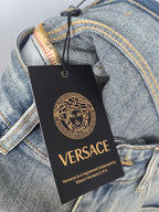 Versace logo hang tag on light-blue denim jeans