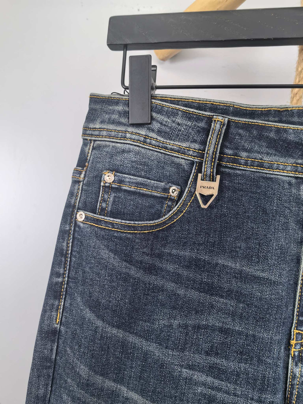 Dark blue denim pants back with two pockets and PRADA patch on waistband.