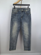 Men's blue denim pants with belt loops and button fly