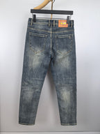 Men's blue denim pants with front pockets and waistband logo patch