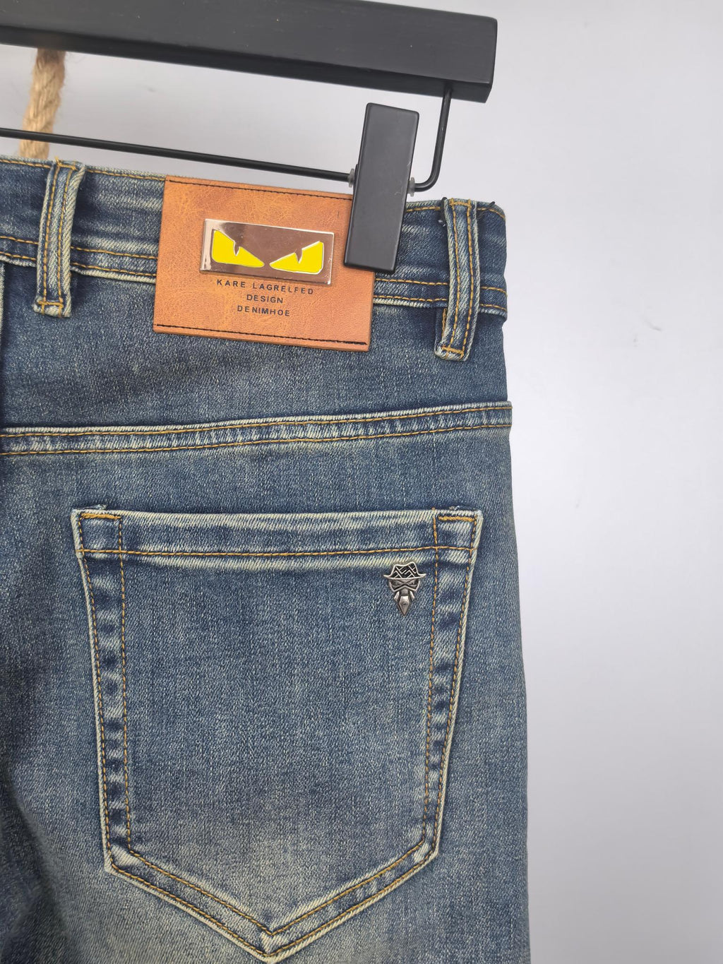 Blue denim pants back with embroidered logo on back pocket