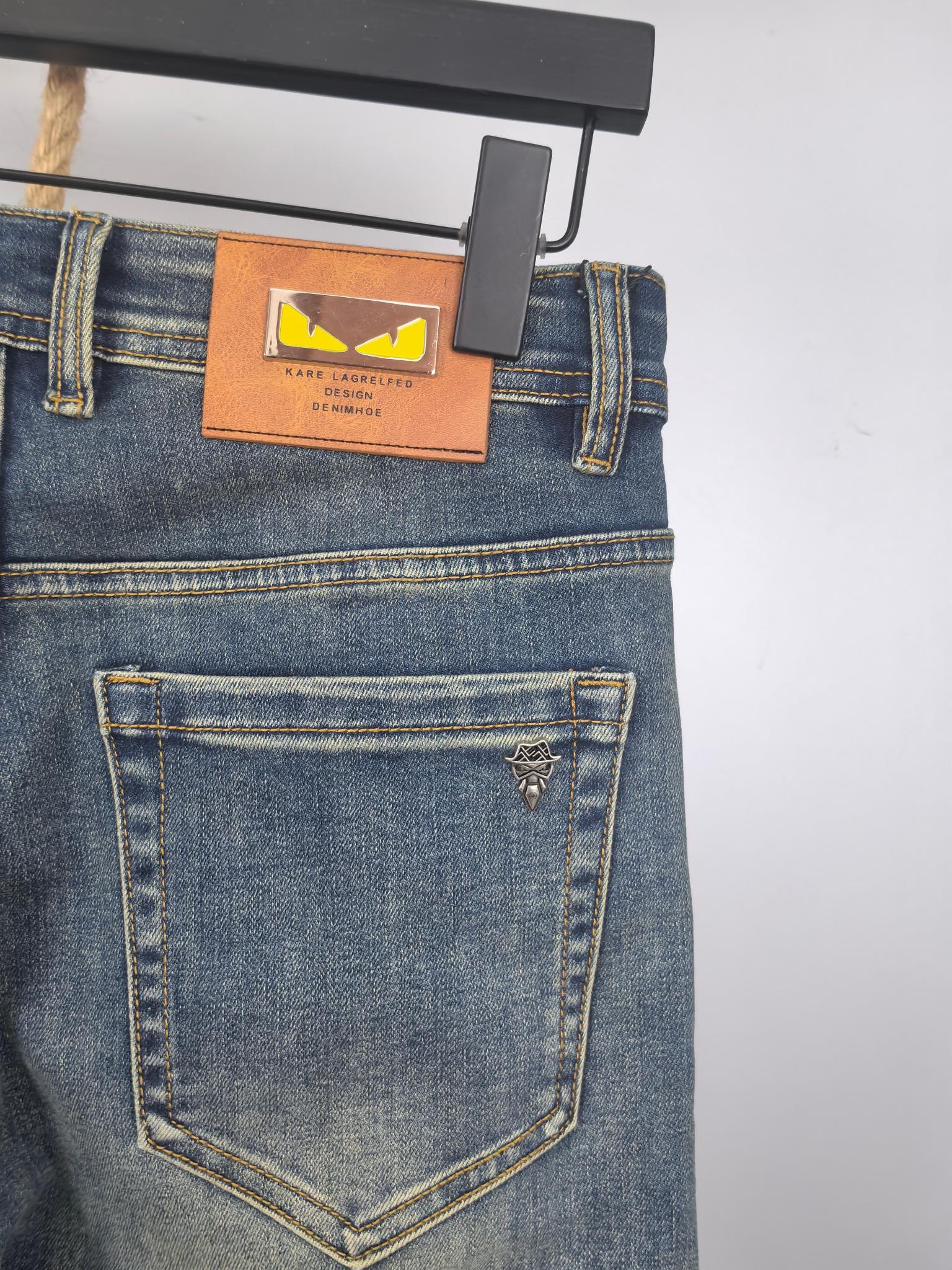 Blue denim pants back with embroidered logo on back pocket