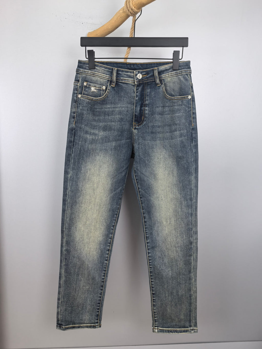 Burberry denim jeans with dark blue wash, belt loops and button fly