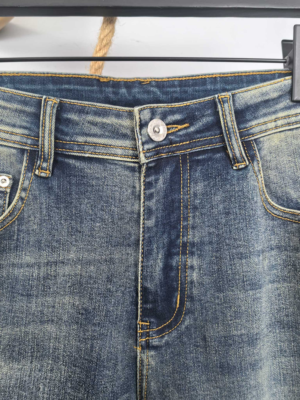 Burberry denim pants waistband with button closure and belt loops, stitched details