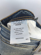 Burberry denim pants interior care label with text and "1973" tag