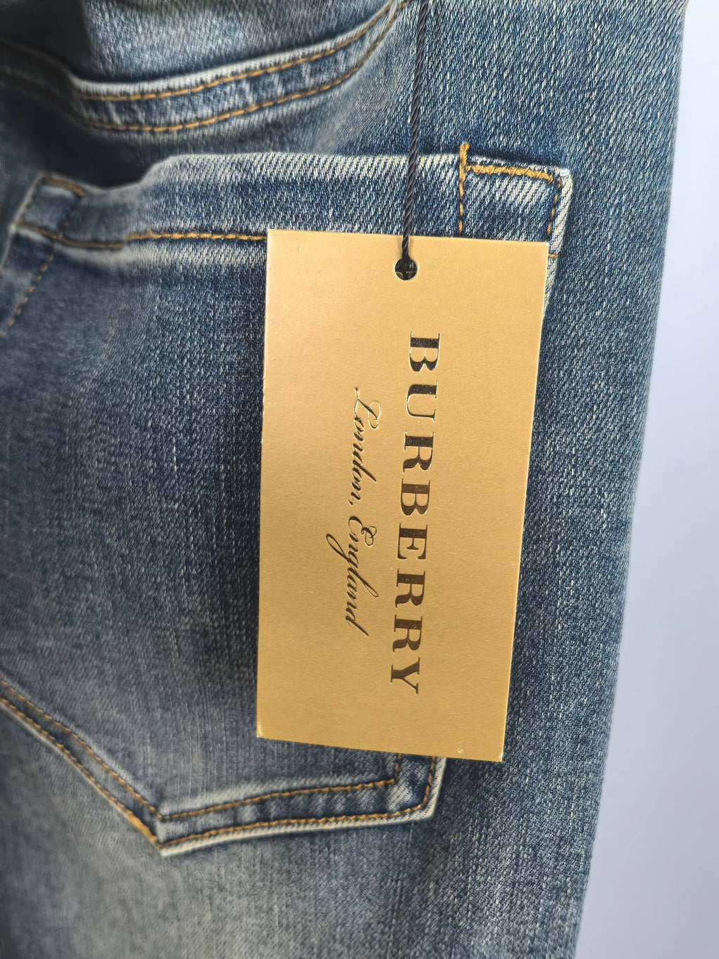 Burberry denim pants leather brand patch with engraved logo tag, dark blue