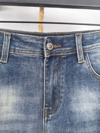 Dark blue denim waistband with button closure and belt loops