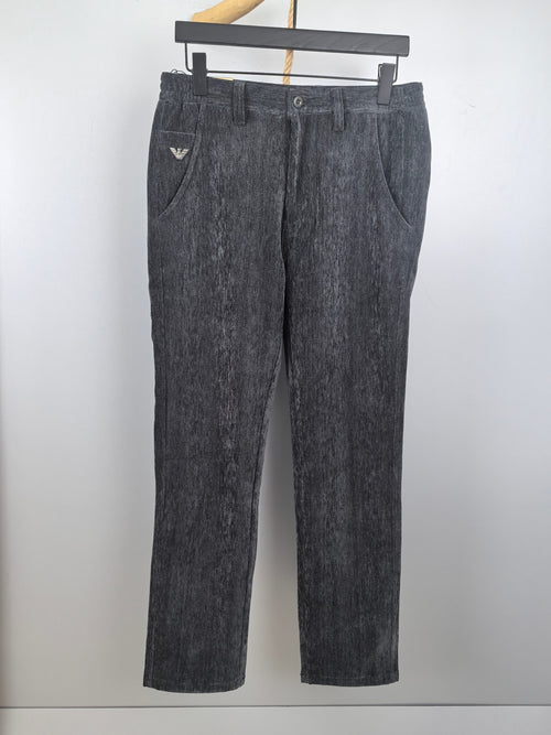 Charcoal textured trousers with belt loops, zip fly, button closure, and straight legs.